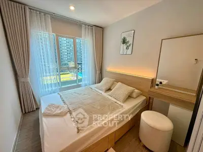 Modern bedroom with large window and stylish decor in urban apartment