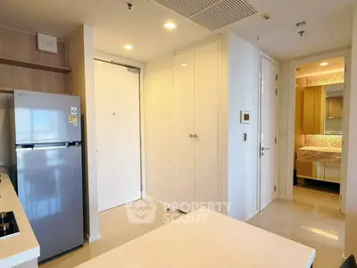 Modern apartment interior with sleek kitchen and cozy bedroom view