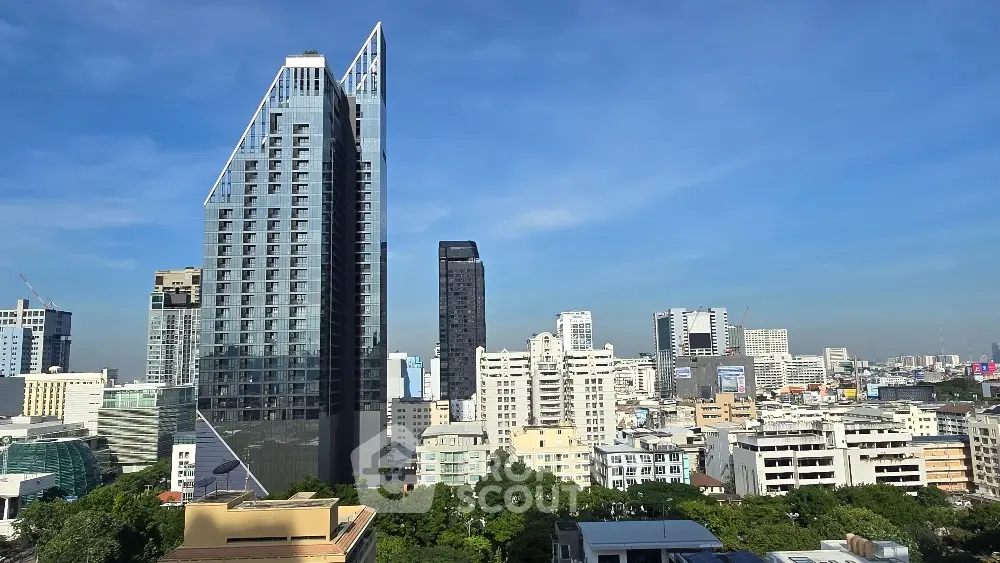 Stunning cityscape view featuring modern skyscrapers and urban skyline under clear blue sky.