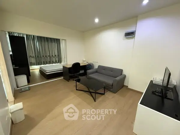 Modern studio apartment with open layout and stylish furnishings