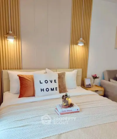 Cozy bedroom with stylish decor and warm lighting, perfect for relaxation and comfort.