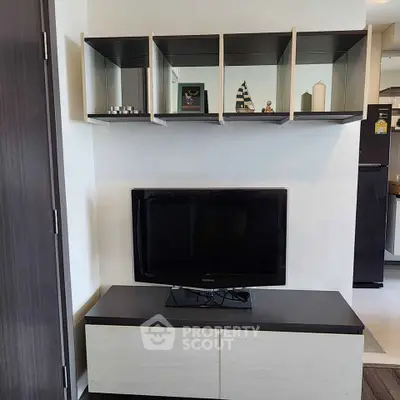 Modern living room with sleek TV unit and open shelving