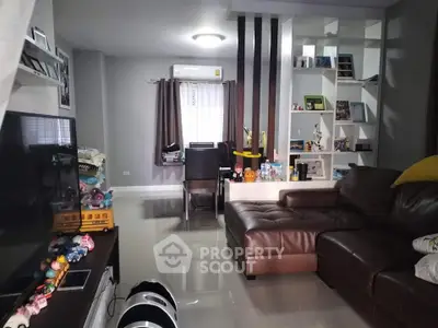 Modern living room with leather sofa and stylish decor