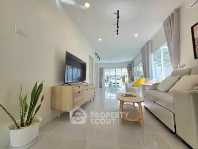 Spacious modern living room with sleek furniture and natural light