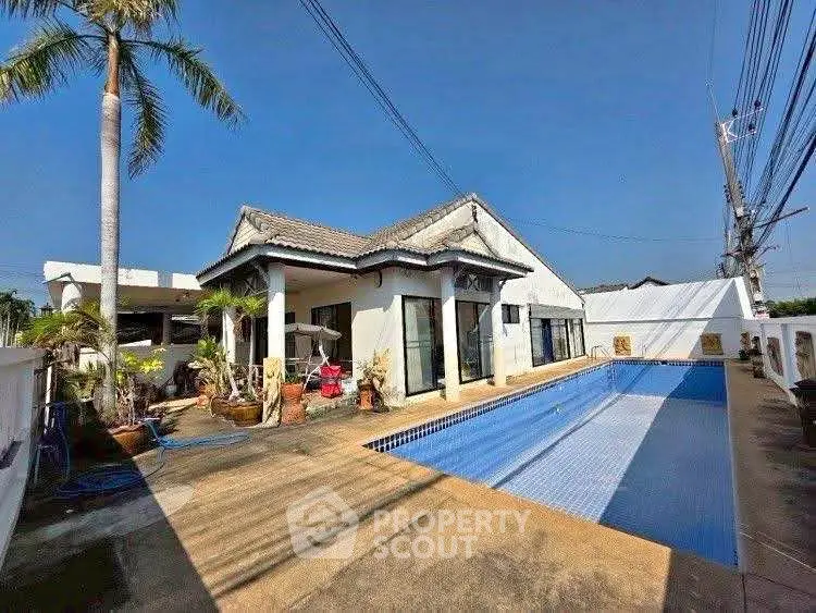 Spacious villa with private pool and lush garden in tropical setting