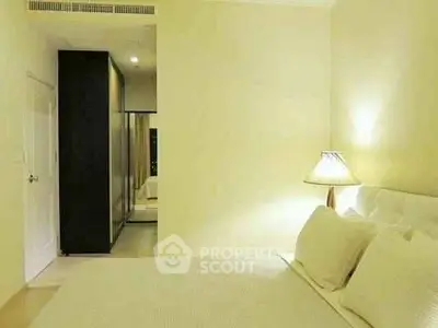 Spacious bedroom with modern design and cozy lighting