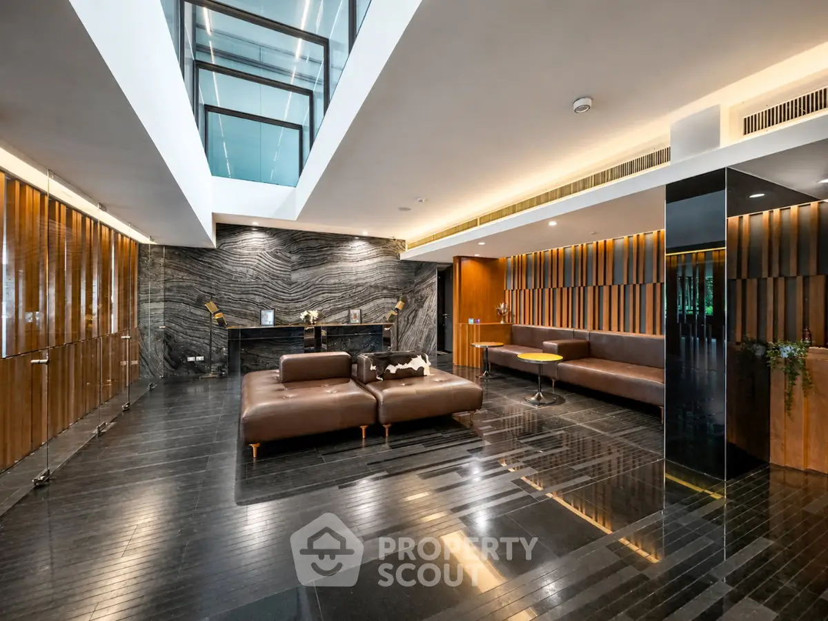 Luxurious modern living room with sleek design and elegant furnishings in upscale property.