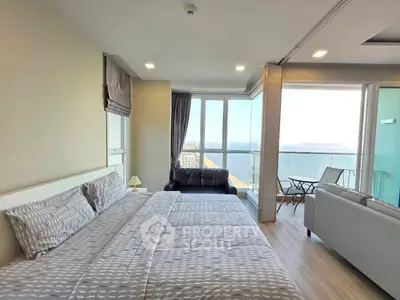 Luxurious bedroom with stunning ocean view and spacious balcony in modern apartment