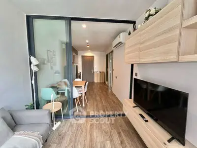 Modern living room with sliding glass doors and stylish wooden furniture