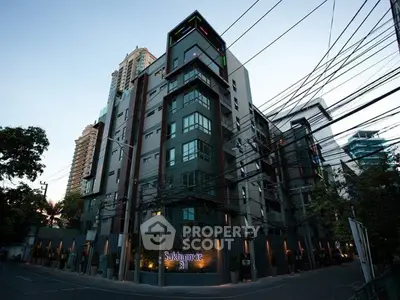 Modern urban apartment building with sleek design in prime city location.