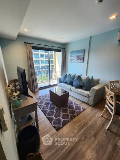 Charming living room with balcony view in modern apartment