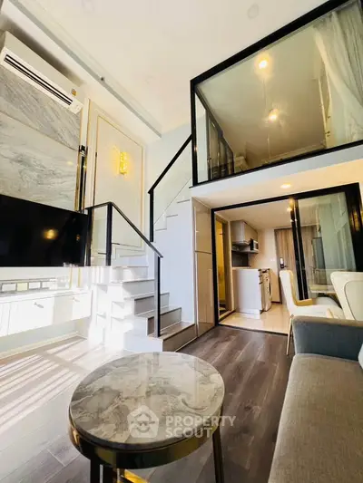 Modern duplex apartment with stylish interior and open layout, featuring a cozy living area and sleek kitchen.