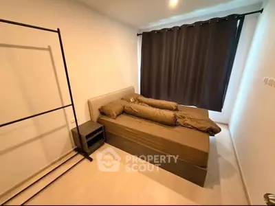 Cozy bedroom with minimalist design and dark curtains