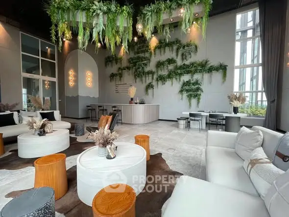 Luxurious modern living room with lush greenery and elegant decor