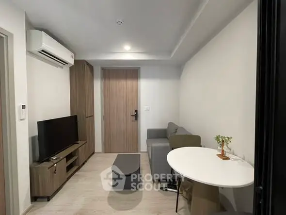 Modern living room with sleek furniture and air conditioning