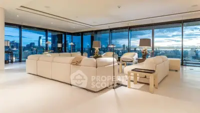 Luxurious living room with panoramic city views and elegant furnishings.