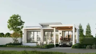 Modern single-story house with sleek design and carport, surrounded by lush greenery.
