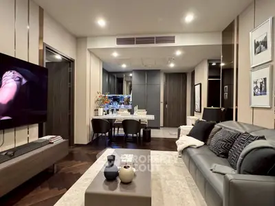 Modern living room with stylish decor and open dining area