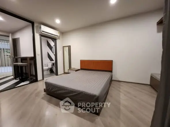 Spacious modern bedroom with minimalist design and natural light