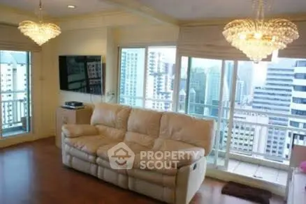 Luxurious living room with stunning city view and elegant chandeliers