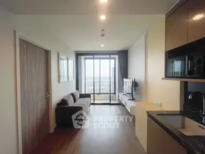 Modern living room with sleek design and stunning city view from large windows.