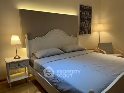 Cozy bedroom with elegant lighting and stylish decor