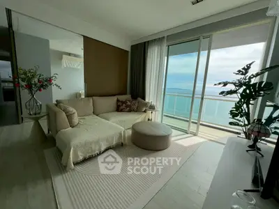 Modern living room with ocean view and large balcony access