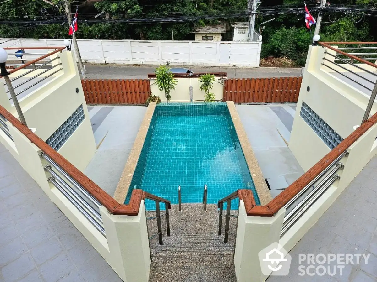 Stunning private pool with modern design and lush surroundings, perfect for relaxation and entertainment.