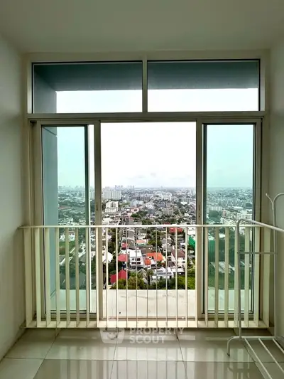 Stunning high-rise balcony with panoramic city view, perfect for urban living enthusiasts.