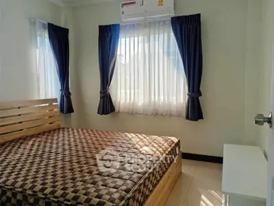 Cozy bedroom with natural light and modern furnishings