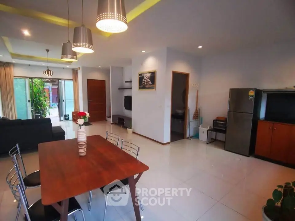 Spacious modern living room with open layout and stylish lighting
