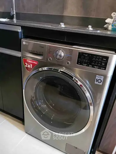 Modern kitchen with sleek washer-dryer combo, perfect for efficient living.