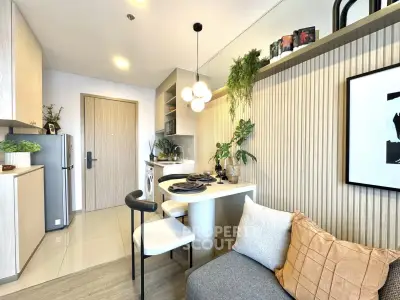 Modern kitchen and living area with stylish decor and open layout