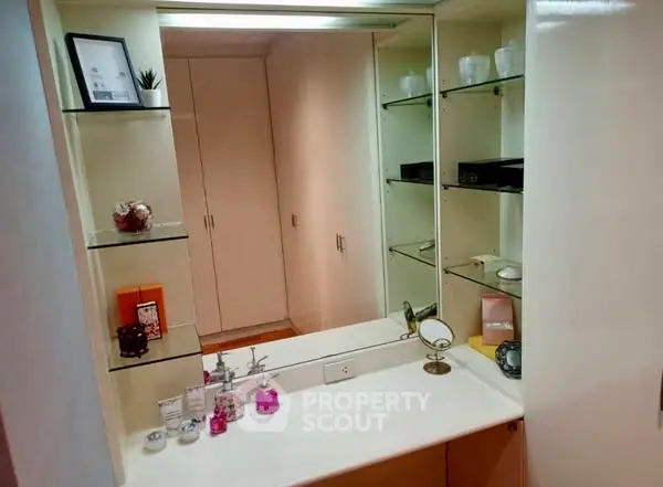 Chic bathroom vanity with mirror and shelves in modern home