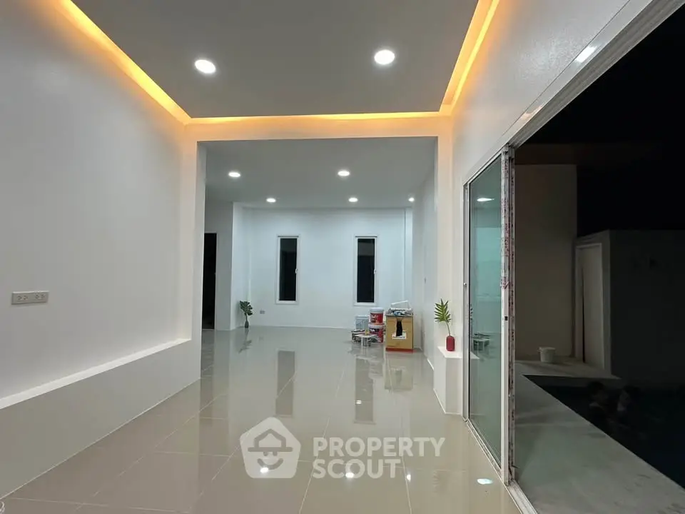 Modern interior with sleek lighting and glossy tile flooring