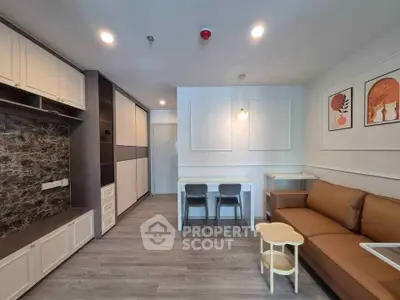 Modern living room with stylish decor, cozy seating, and elegant dining area in a contemporary apartment.