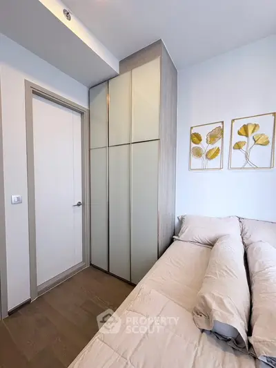 Cozy bedroom with modern decor and built-in wardrobe