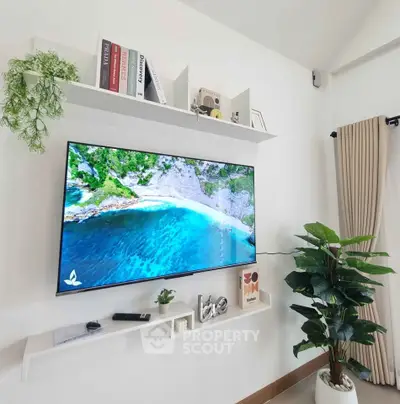 Modern living room with wall-mounted TV and stylish decor