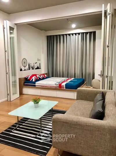 Modern studio apartment with stylish decor and cozy living area.
