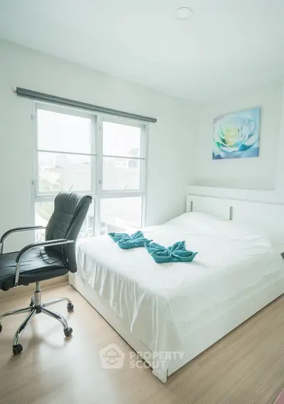 Bright and airy bedroom with modern decor and large windows