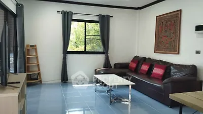Cozy living room with leather sofa and modern decor