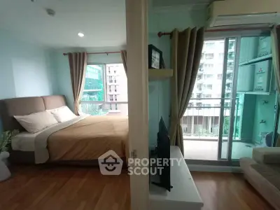 Modern bedroom with balcony view in urban apartment