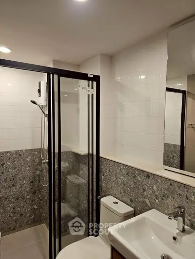 Modern bathroom with sleek shower enclosure and contemporary fixtures