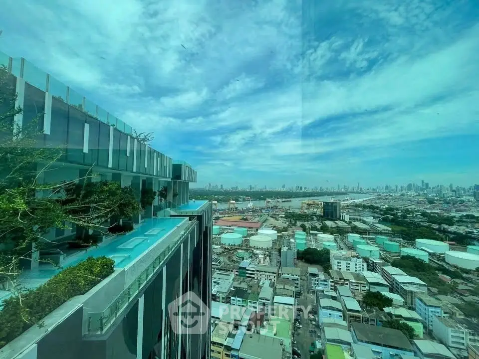 Stunning cityscape view from a high-rise building with a luxurious rooftop pool.