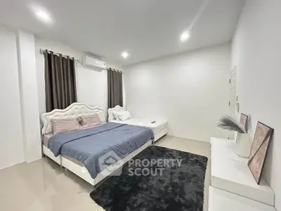 Spacious modern bedroom with elegant decor and cozy ambiance