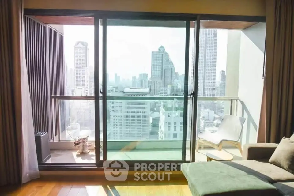 Luxurious high-rise apartment with stunning city view from spacious balcony.