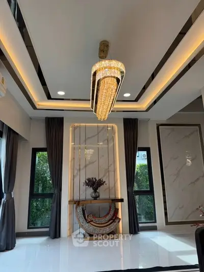 Luxurious living room with elegant chandelier and modern decor
