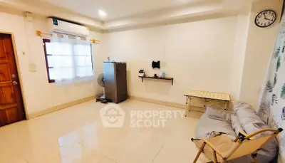 Spacious living room with minimalist decor and natural light