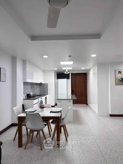 Modern kitchen and dining area with sleek design and stylish furniture
