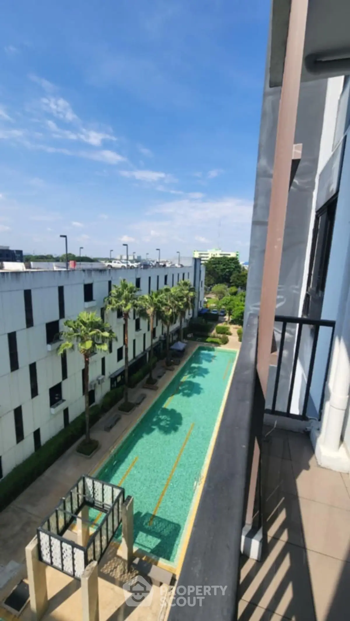 Stunning pool view from balcony in modern residential complex